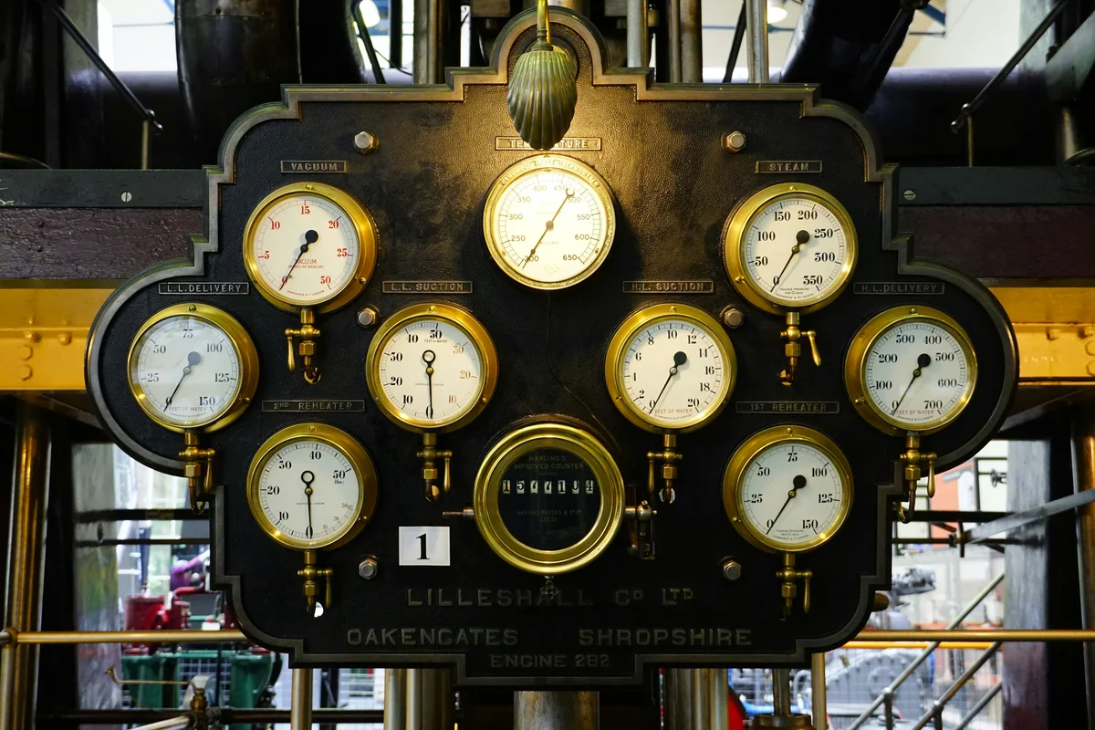 Industrial control panel with pressure and temperature gauges